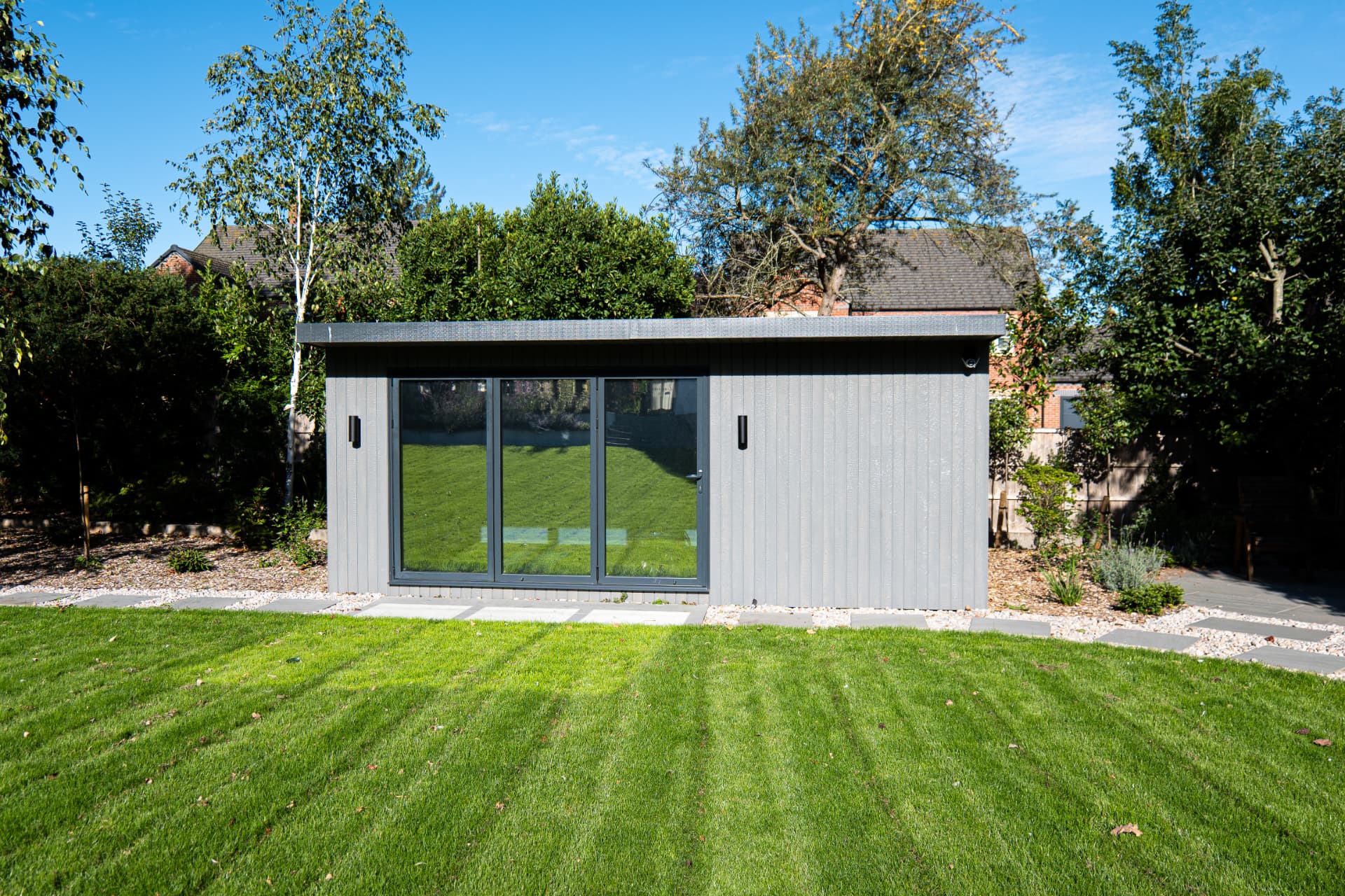6m x 3.2m Signature SIPs garden room in Mountain Ash ToughWood, front on with sliding doors
