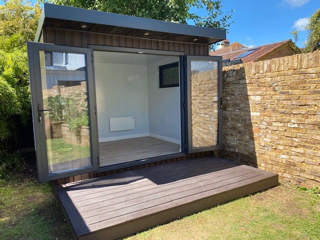Braemore garden room interior with heater and light oak flooring