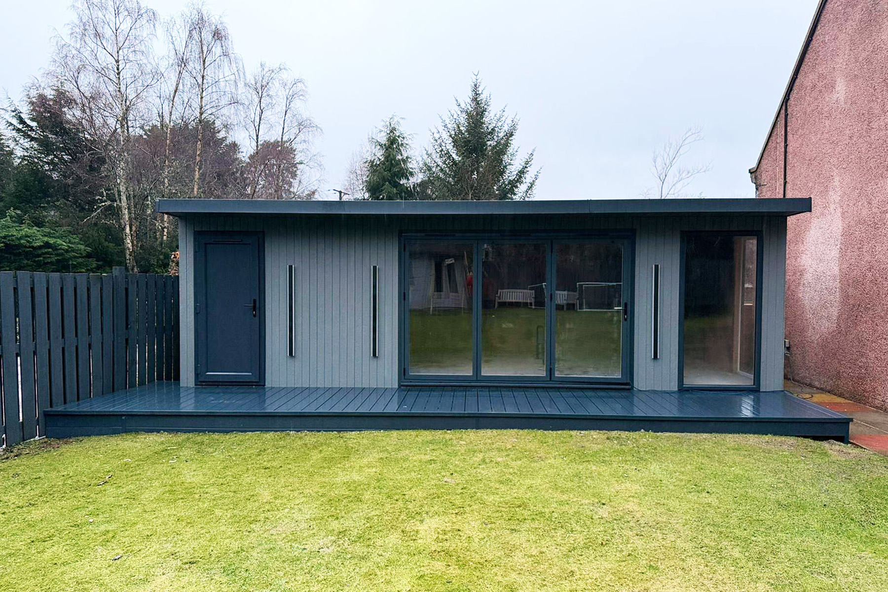 7.8m x 3.8m Signature SIPs garden room in Mountain Ash ToughWood on a full-width deck