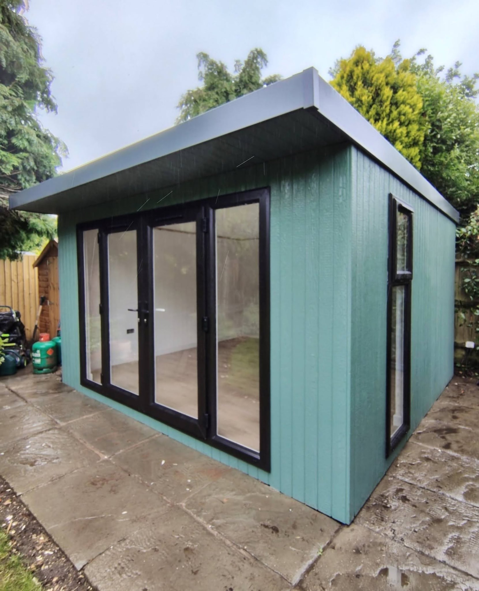 4.2m x 3.8m Signature SIPs garden room in a custom green ToughWood finish