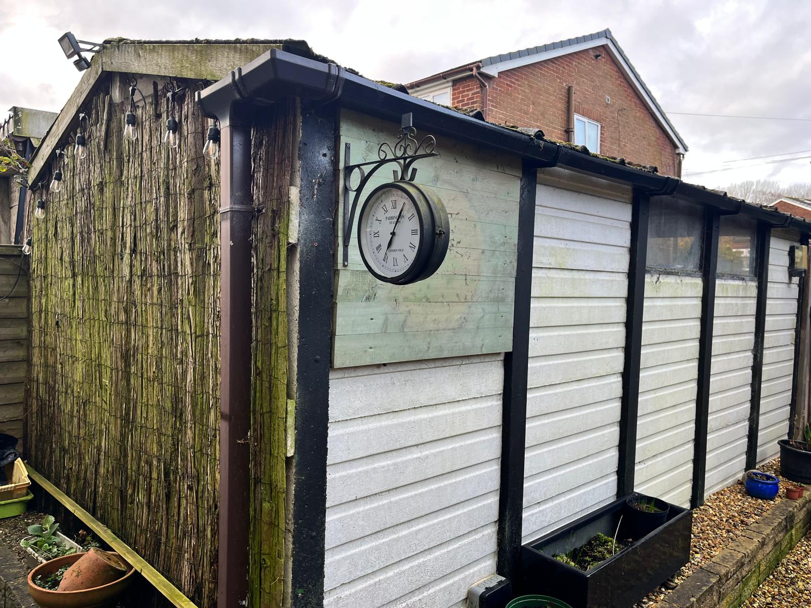 Tired garden corner with an old shed before a garden room was added