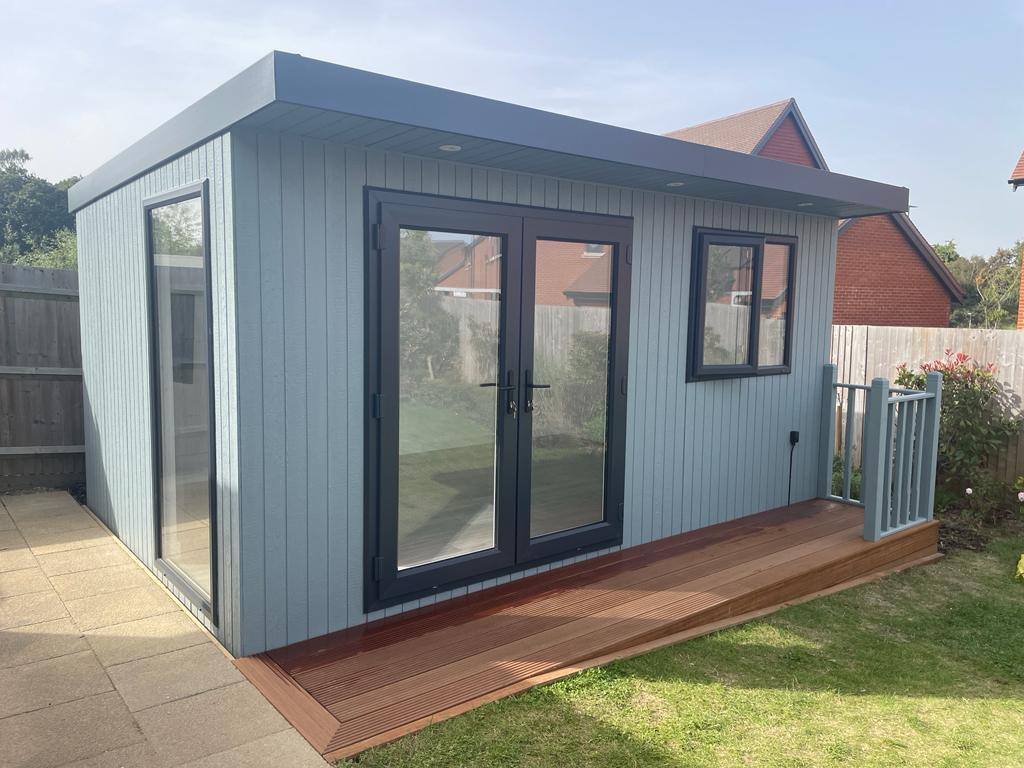 4.6m x 3m Signature SIPs garden office in a custom blue ToughWood shade with hardwood deck